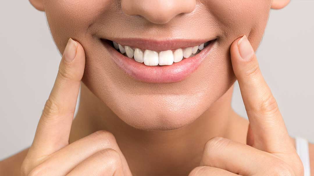 Closeup view of female wide cheerful smile